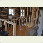 Flooring in kitchen/bath: 8" pine planks. One coat of poly so far.