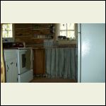 Kitchen- though the cabinetry is now all painted white