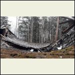 the badly damaged barn roof