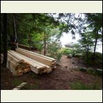 lumber pile by boat