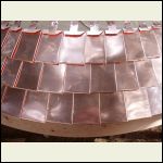 handmade copper shingles on staircase turret roof