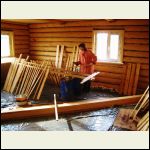 My wife Raisa, painting the window trim