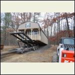 The cabin being set on the stone pad