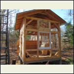 The north side with a large double-hung and smaller hinged windows The north side with a large double-hung and smaller hinged windows