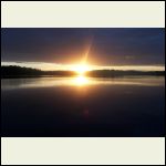 sunset over lake while fishing