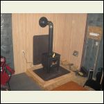 Here is another picture of the woodstove installed with the platform i was required to sit it on