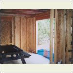 Kitchen area where pocket doors will go out to the sunroom/screen porch