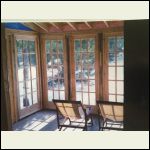 Inside the sunroom looking out the new windows