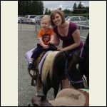 Grandson on Pony with my daughter