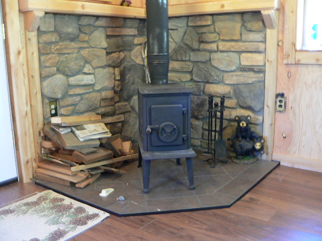 Tiny Wood Stove - When installing a tiny wood stove, chances are there  isn't much room to spare in the first place. But with an adequate heat  shield, the space you need