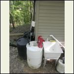 Rain barrel with pitcher pump