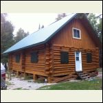 Cleaned and stained the cabin,installed shutters