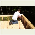 My son nailing down loft flooring