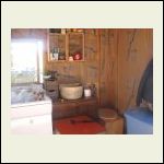 The kitchen with humanure toilet in right corner