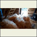 Bales of chinking material in the cabin.