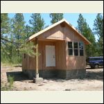 Bascial dried in shell, metal roof was subleted out. No porch yet