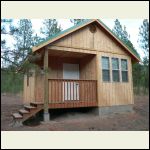 Metal roof in place, porch all built.