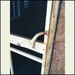 Installed screen door with antler handle