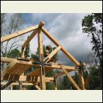 Roof frame being placed on sill plates