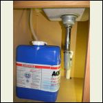Undersink water jug and flexible sink trap