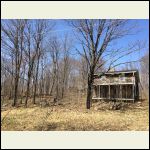 Old house with barn in background