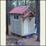 Little shower house in the woods.