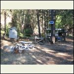 outhouse, solar panel, unpainted camper