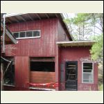 Old cabin used as a storage shed.