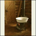 Enamel washbasin on small stove