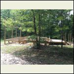 Left to right: front porch, main cabin, back deck