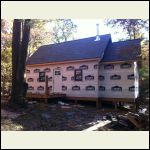 Back of cabin with windows and door installed.