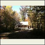 Cabin framed by Fall color.